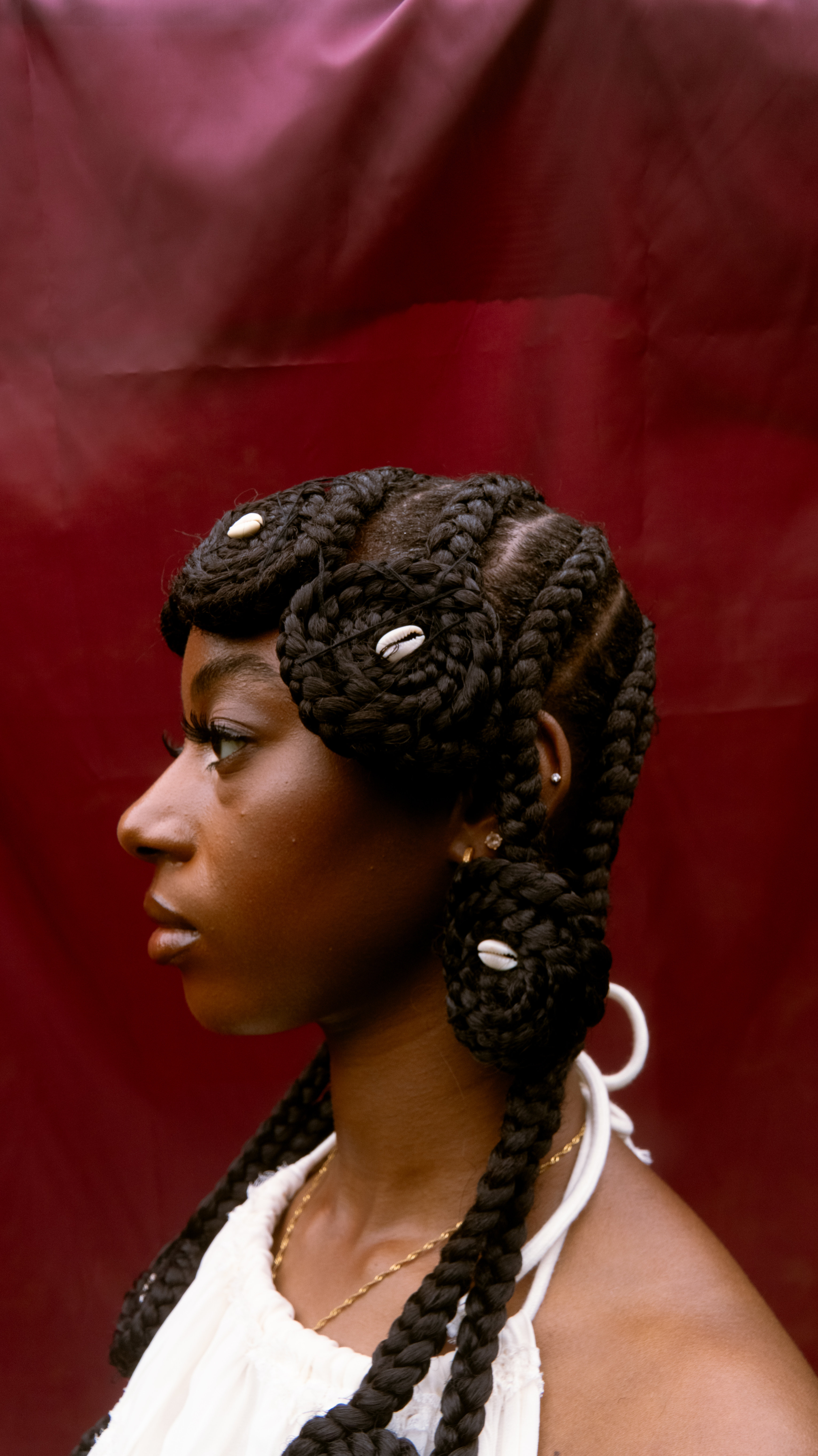 Side profile portrait highlighting traditional hairstyle